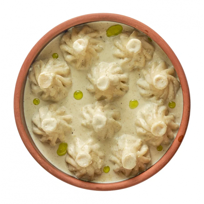 Мини-хинкали с курицей в соусе чкмерули